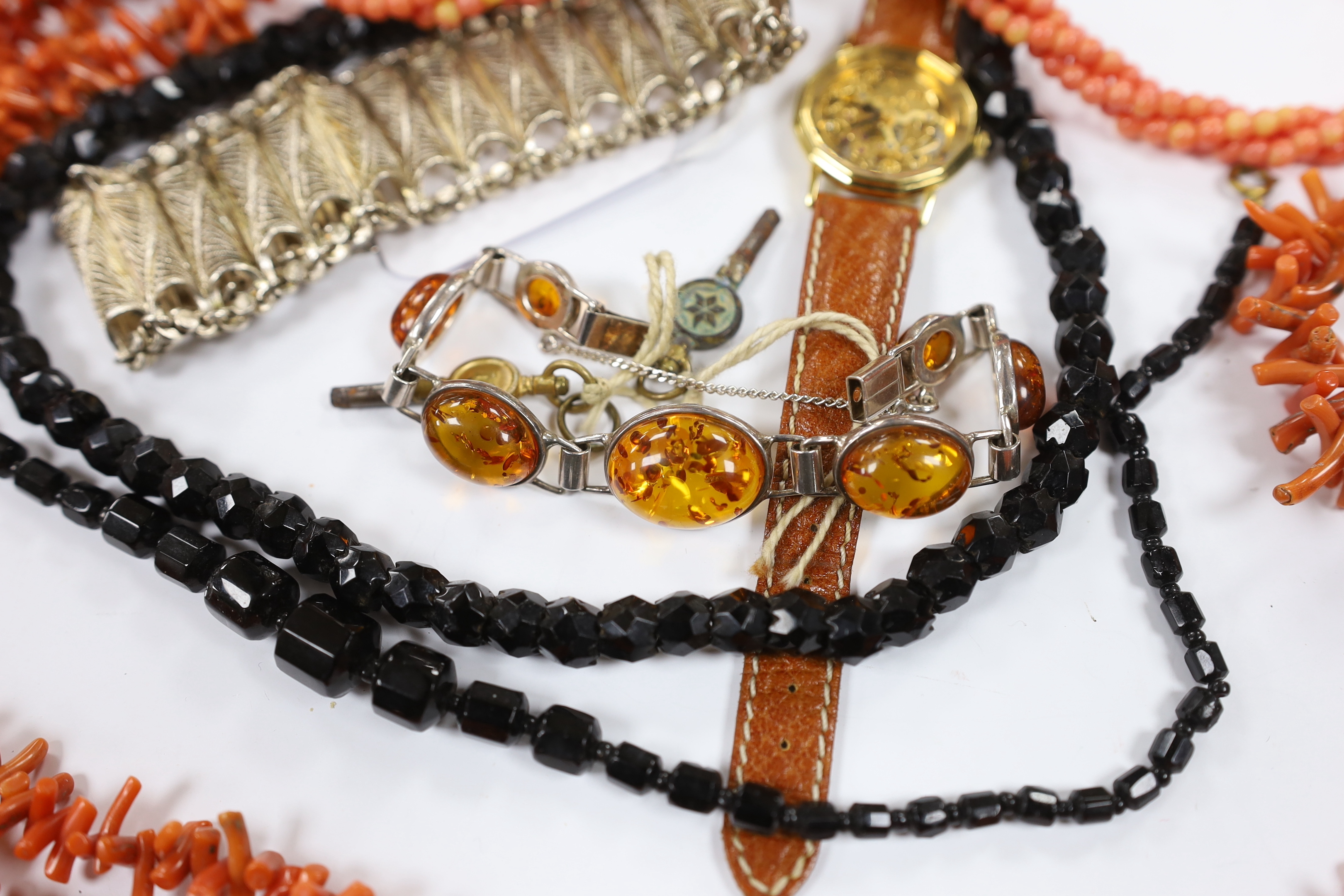 A continental 835 filigree white metal bracelet, a 925 and amber bracelet and other items including a wrist watch and a coral branch necklace.